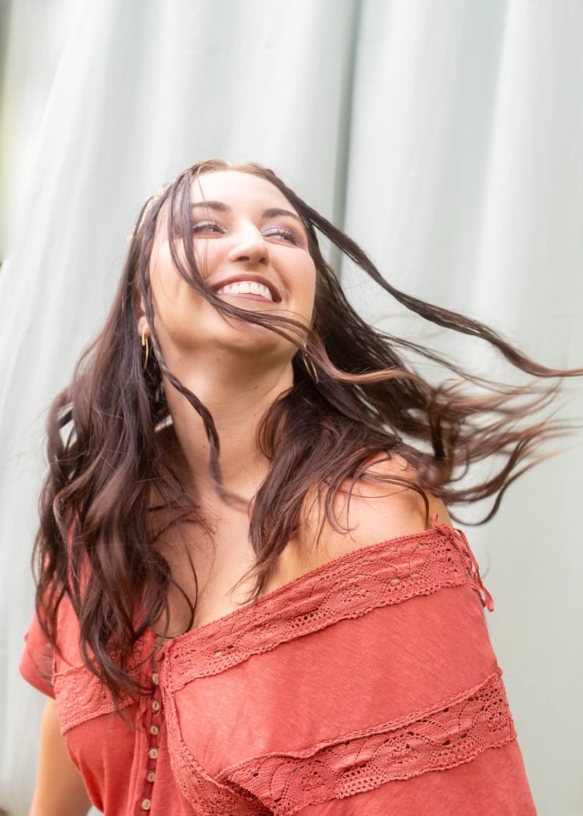 woman smiling and flipping hair